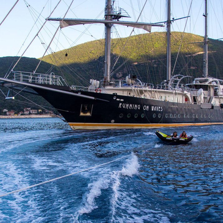 guests on water banana next to ship next to islands