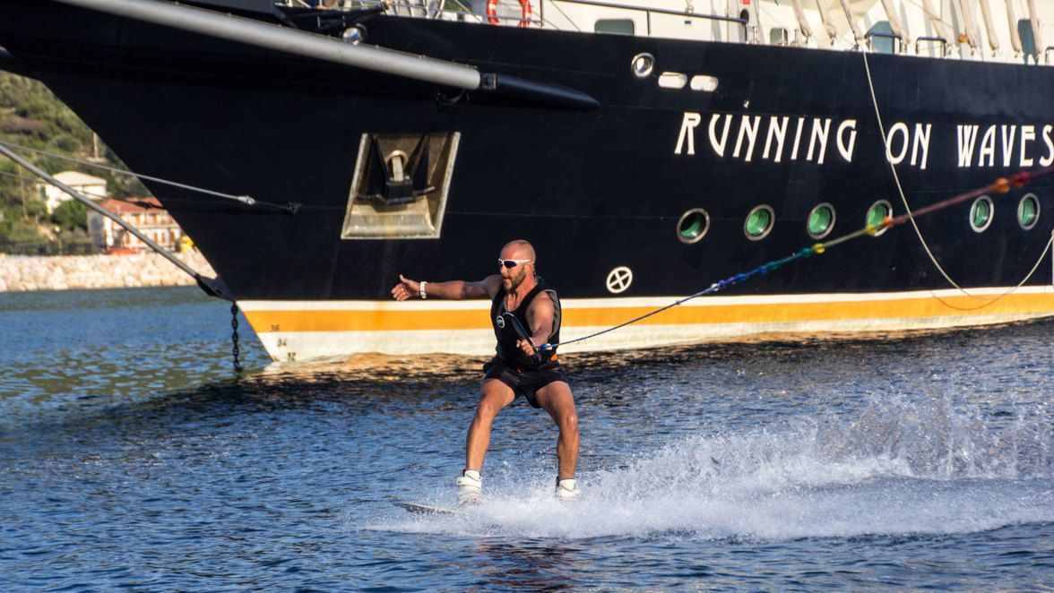 wake board next to ship next to island