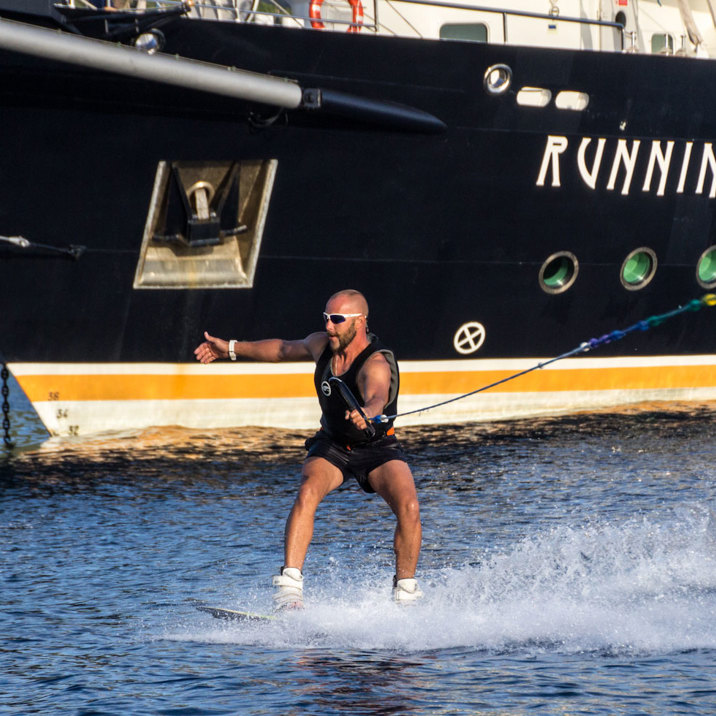 wake board next to ship next to island