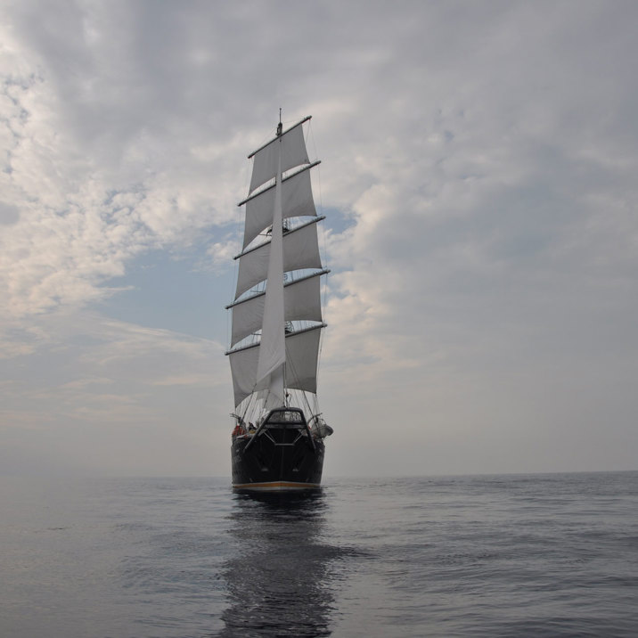 ship front side at sea with clouds 