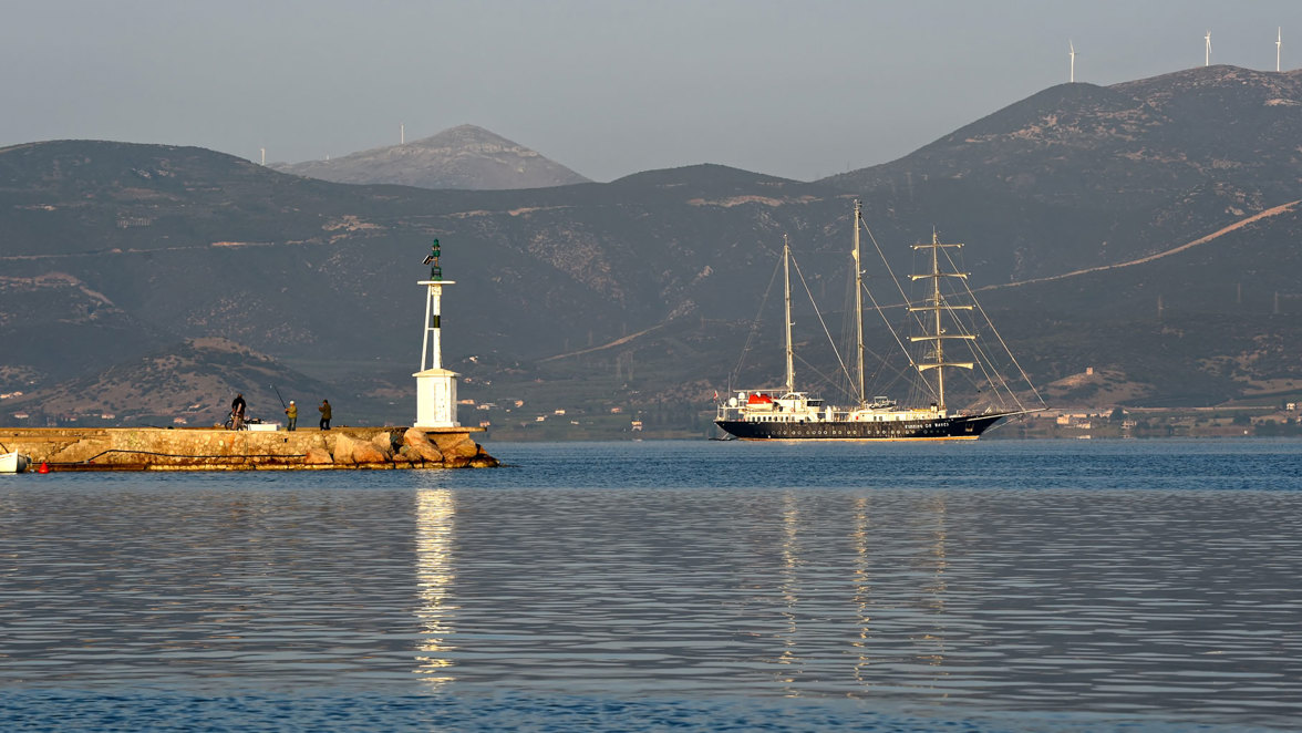 ship near hilly island's harbor