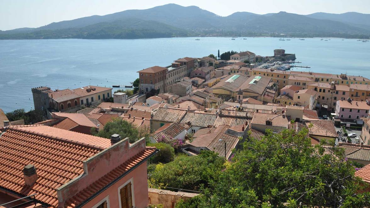 town red rooftops and coast view