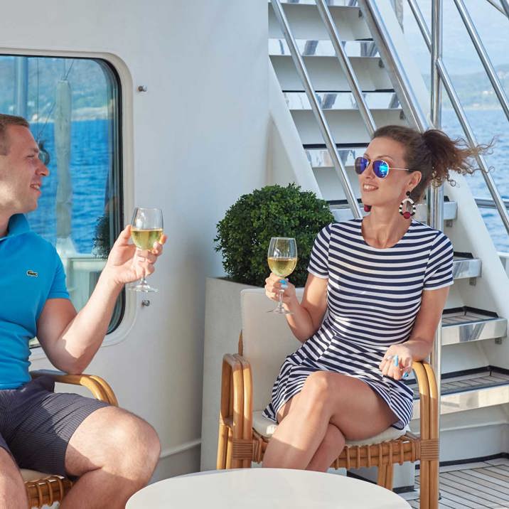 guests on the deck with wine glasses